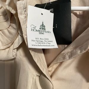 Cream colored woman’s light weight coat